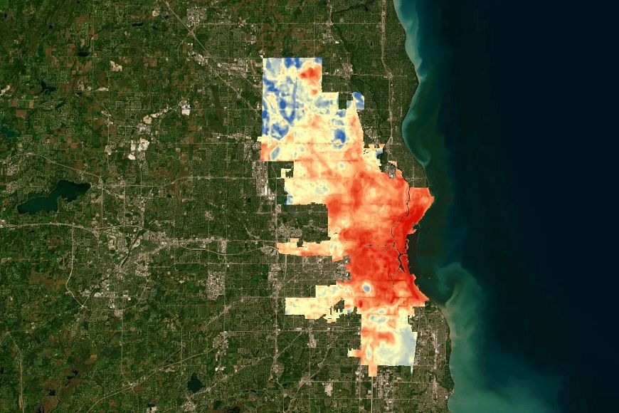 A heat map of the city of Milwaukee, showing the highest temperatures in red and the lowest in pale yellow.