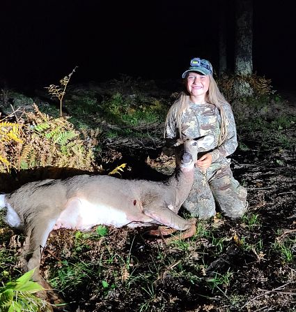 girl with harvested deer