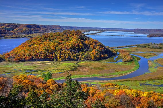 Stunning fall colors along a river as viewed from an elevated vantage point at Perrot State Park