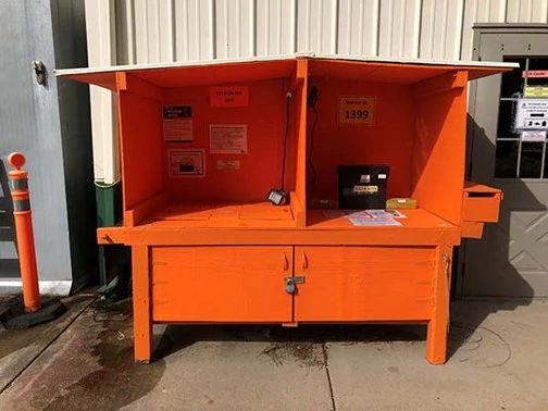 A bright orange kiosk for collecting CWD samples