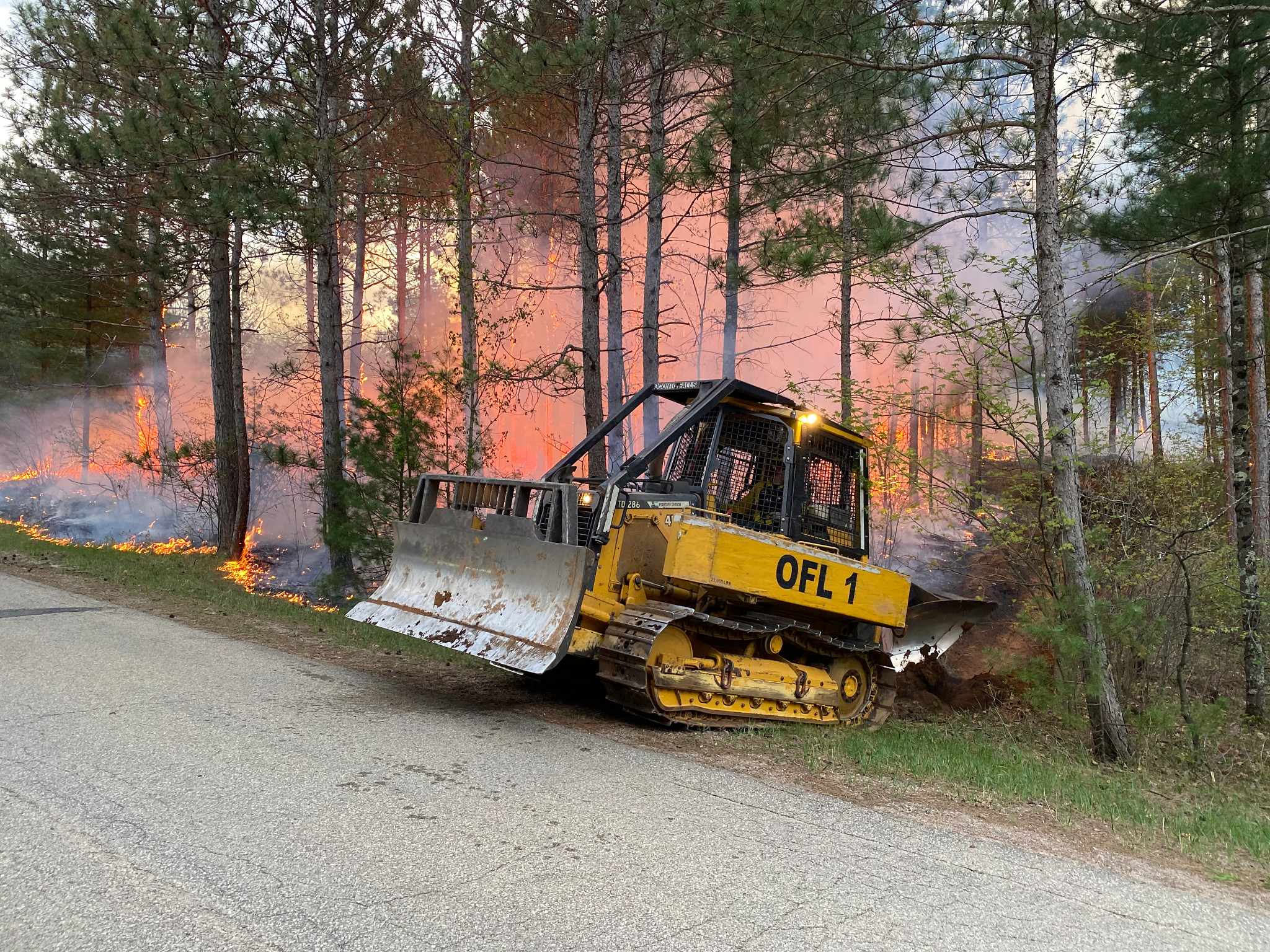 A DNR tractor-plow digs a fireline to contain a fire on May 14 in partnership with Menominee Tribal Enterprises. Please avoid burning due to very high fire danger. 
