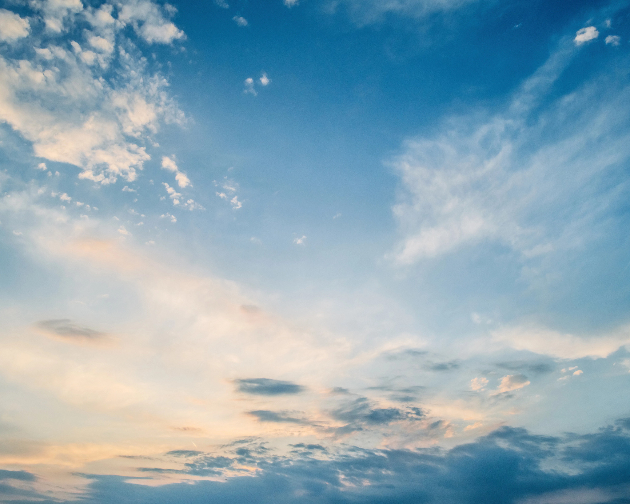 Blue sky with some white clouds. 