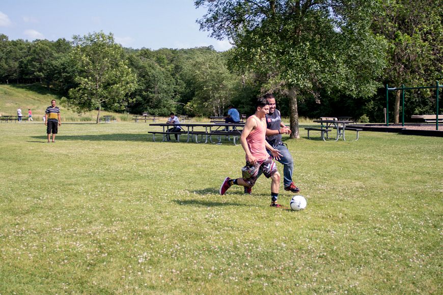 Two men playing Soccer at Willow River State Park