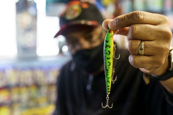 Tommy White holds a fishing lure