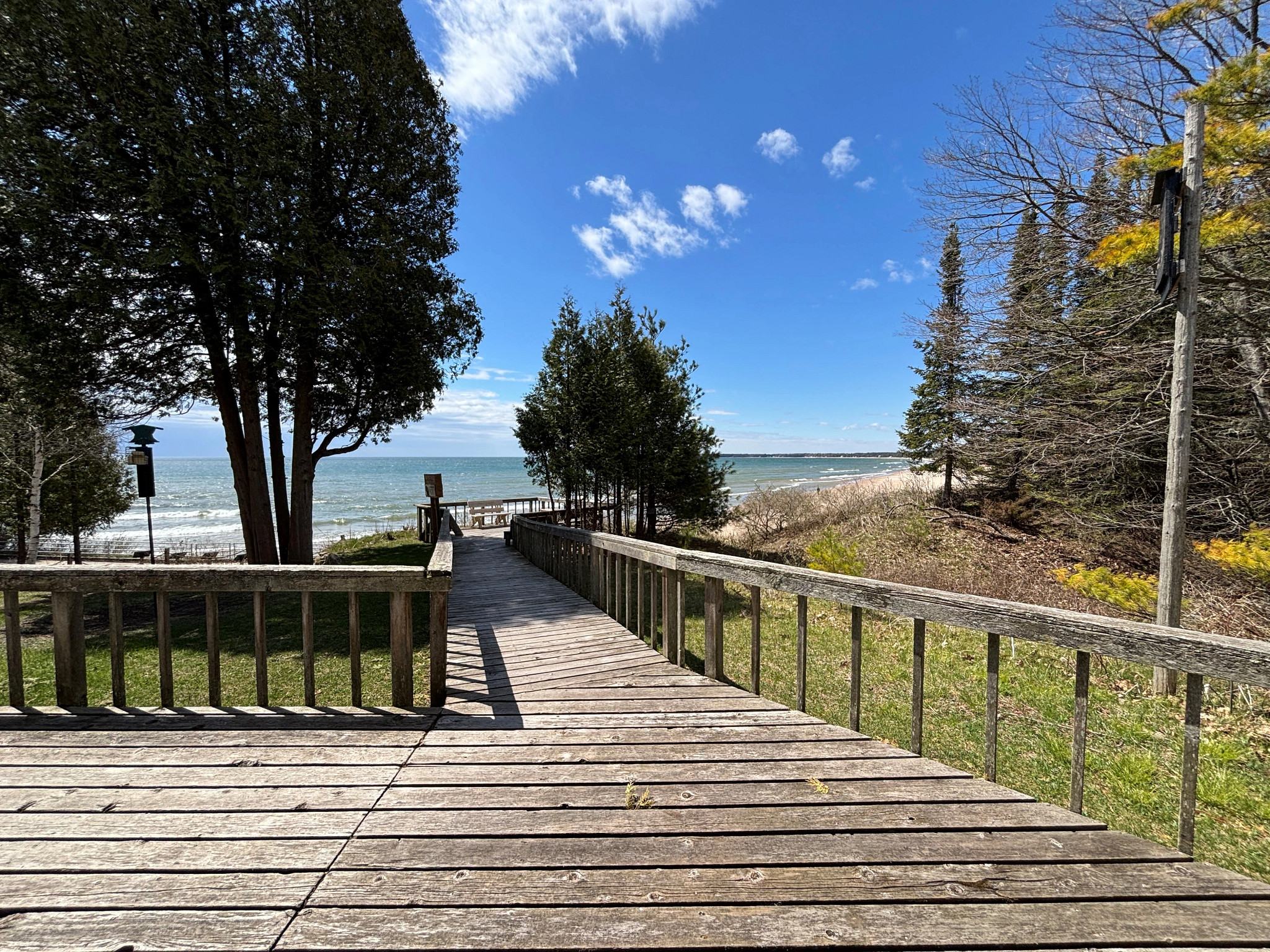 View of the beach and water on a sunny day on the observation deck.
