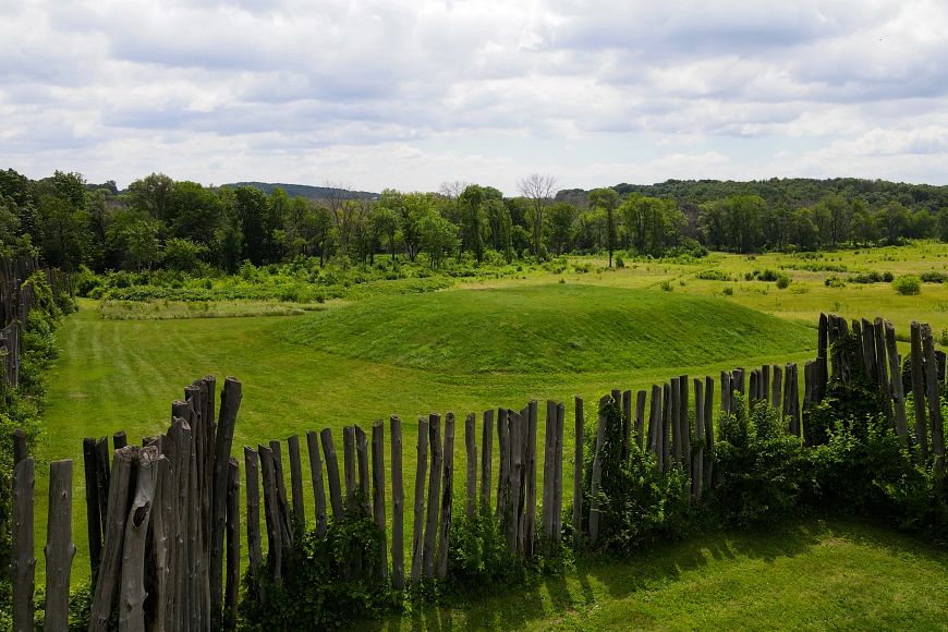 A mound at Aztalan State Park surrounded by a stockade.