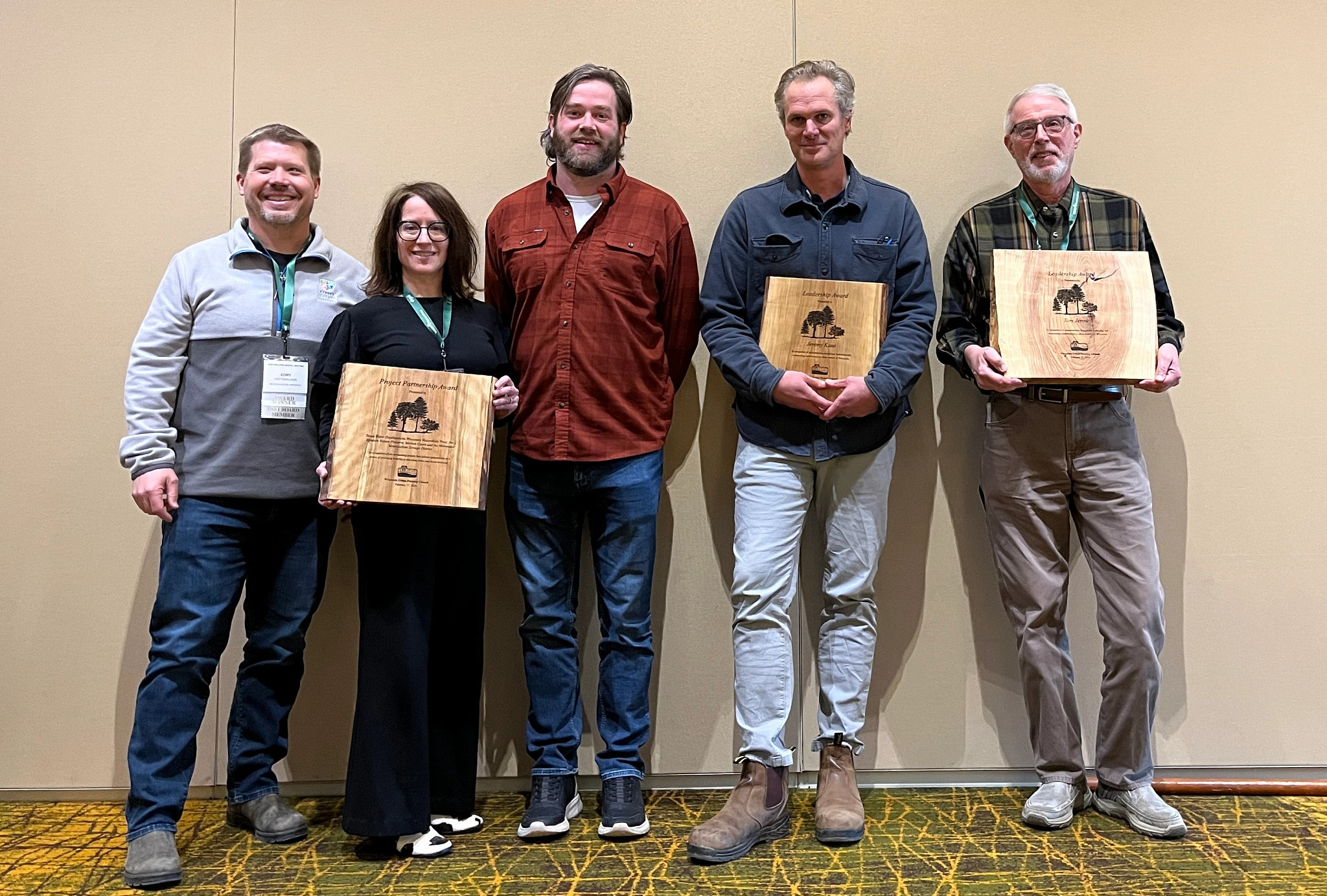 2026 Wisconsin Urban Forestry Council award winners holding wooden plaques 