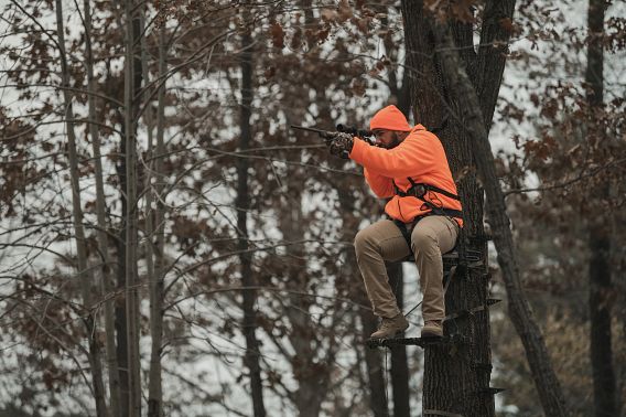 Hunter sitting in a tree stand