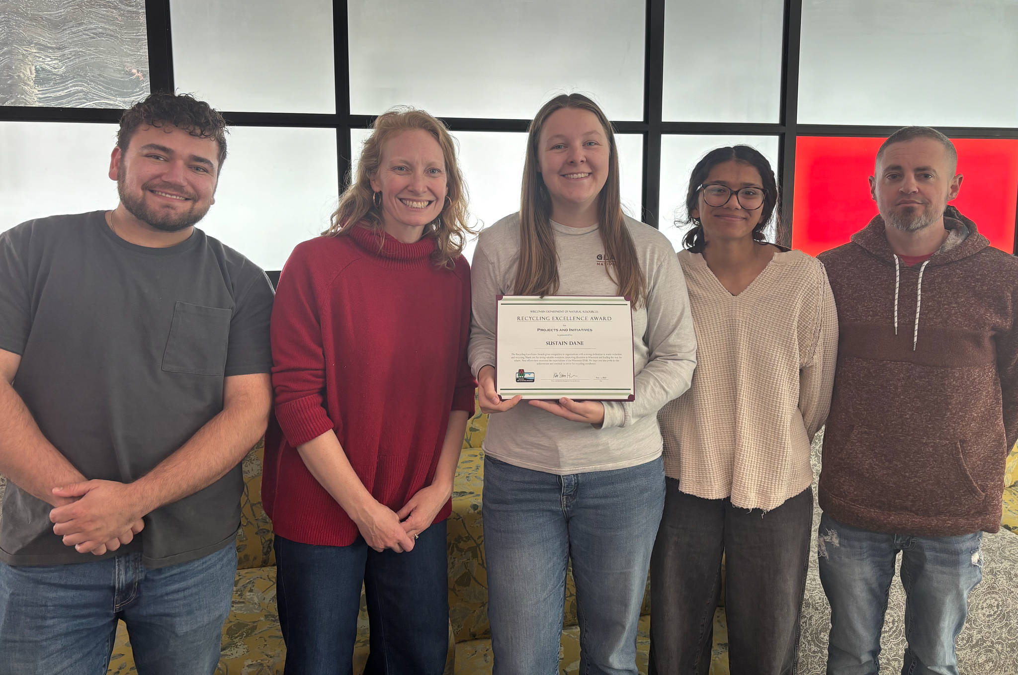 Members of Sustain Dane posing with Recycling Excellence Award