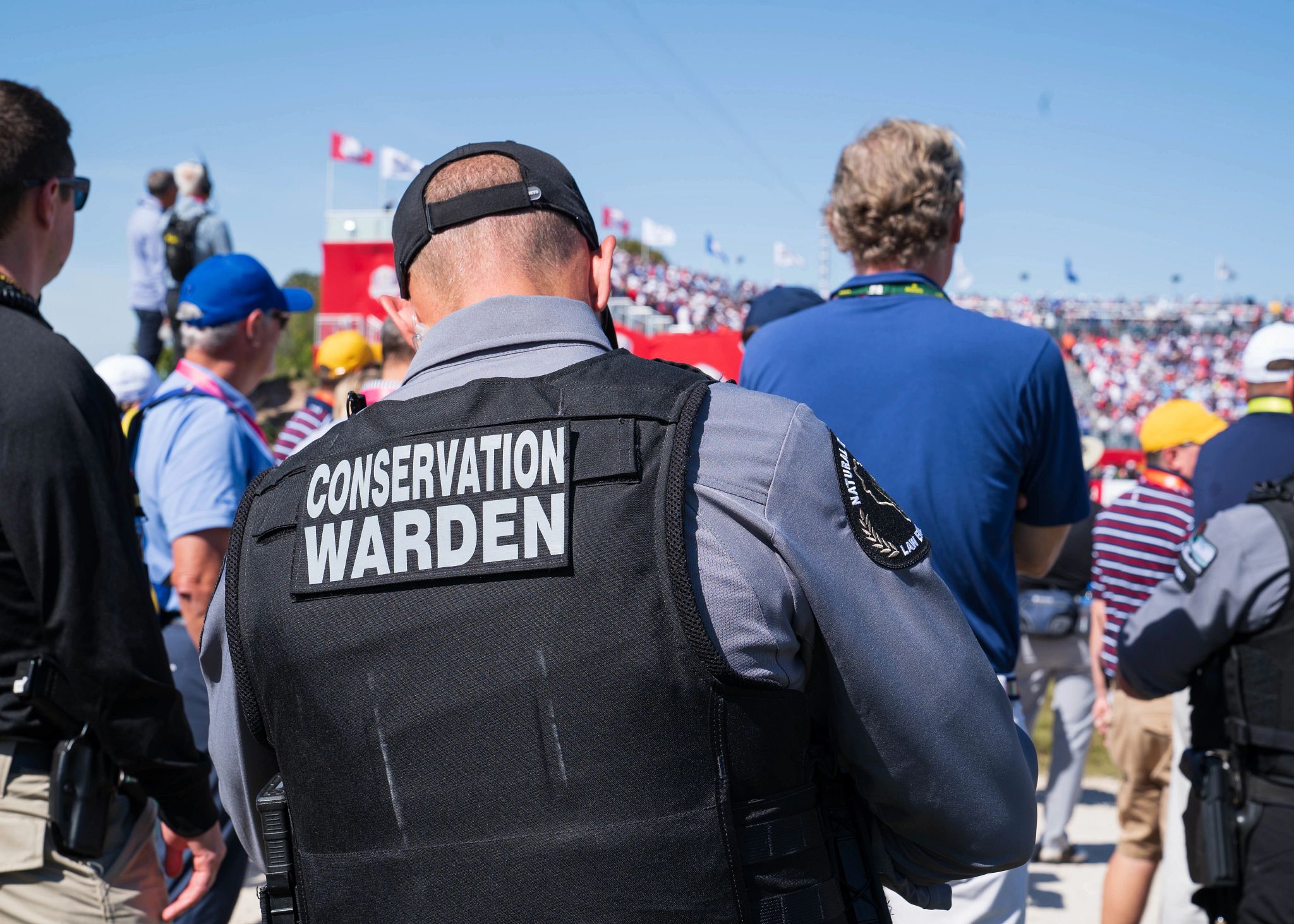 An image of a DNR Conservation Warden patrolling and event. 