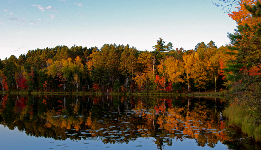 View of Cunard Lake with fall foliage reflected in the water