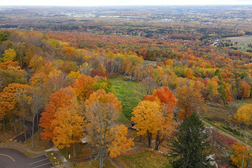 aerial view of Rib Mountain State Park in the fall with colorful trees
