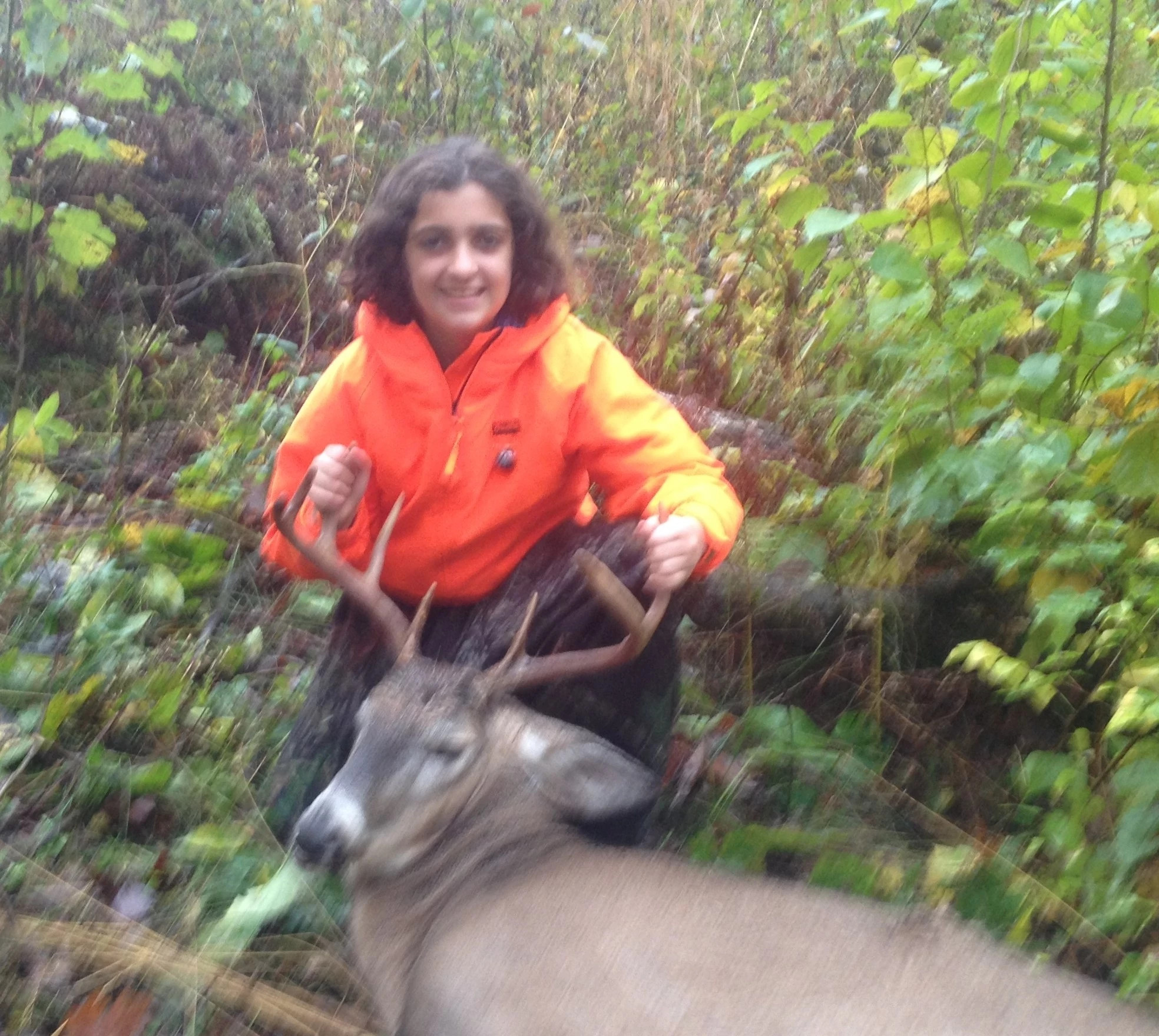girl and harvested buck