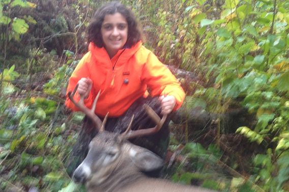 girl and harvested buck