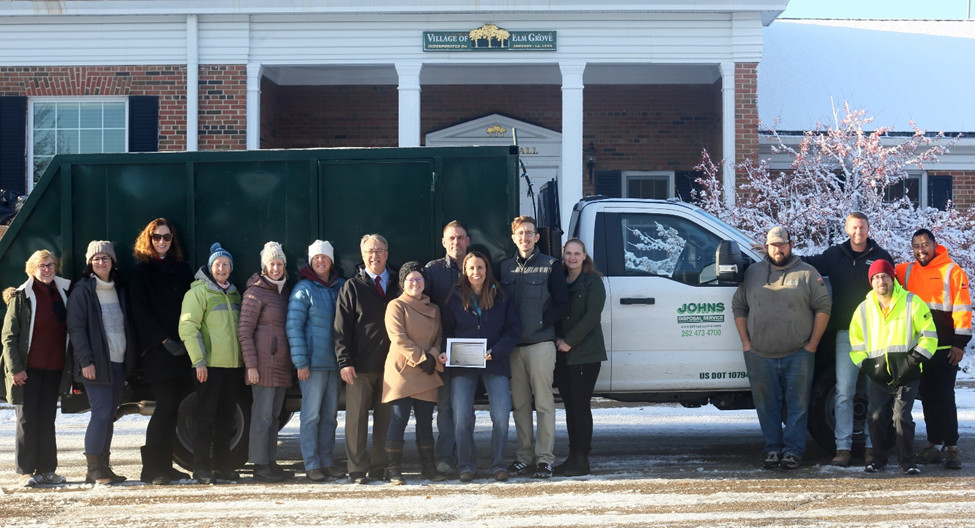 Elm Grove green team poses in front of a recycling truck