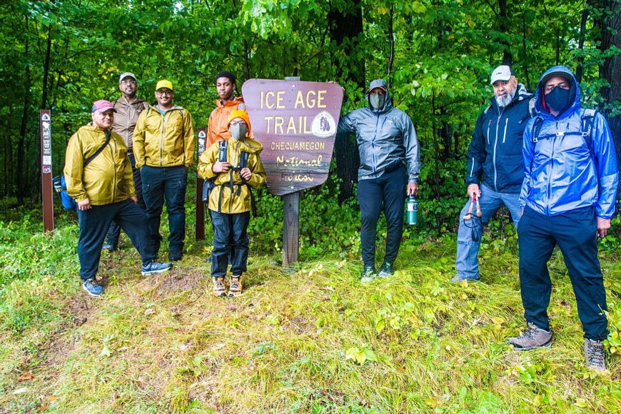 group of hikers at Ice Age Trail sign in Northwoods