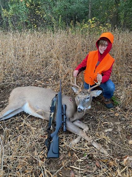 boy with harvested deer