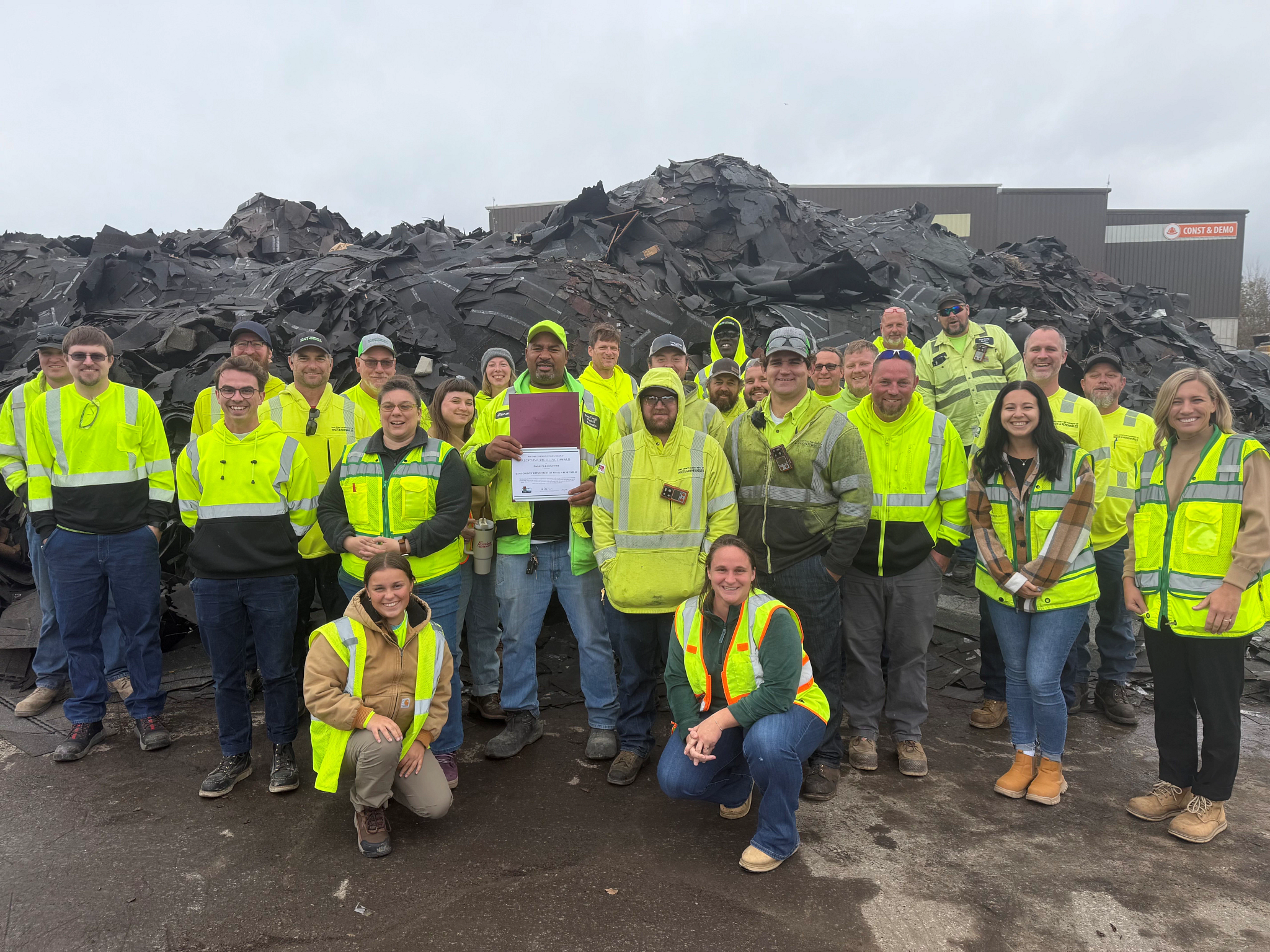 Employees of Dane County posing with Recycling Excellence Award