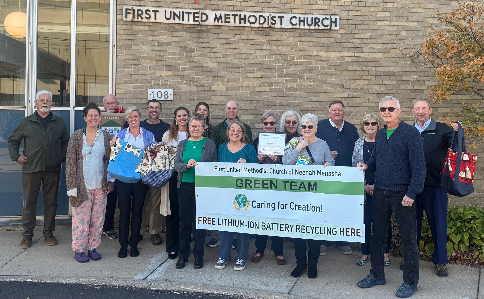 Members of First United Methodist Church posing with Recycling Excellence Award