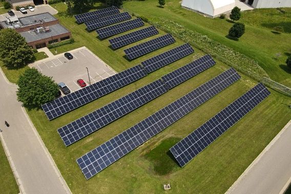 An aerial view of a large solar array in the city of Sun Prairie