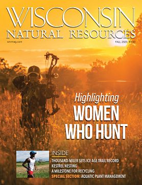 Fall magazine cover with woman shooting hunting bow in glowing sunlight