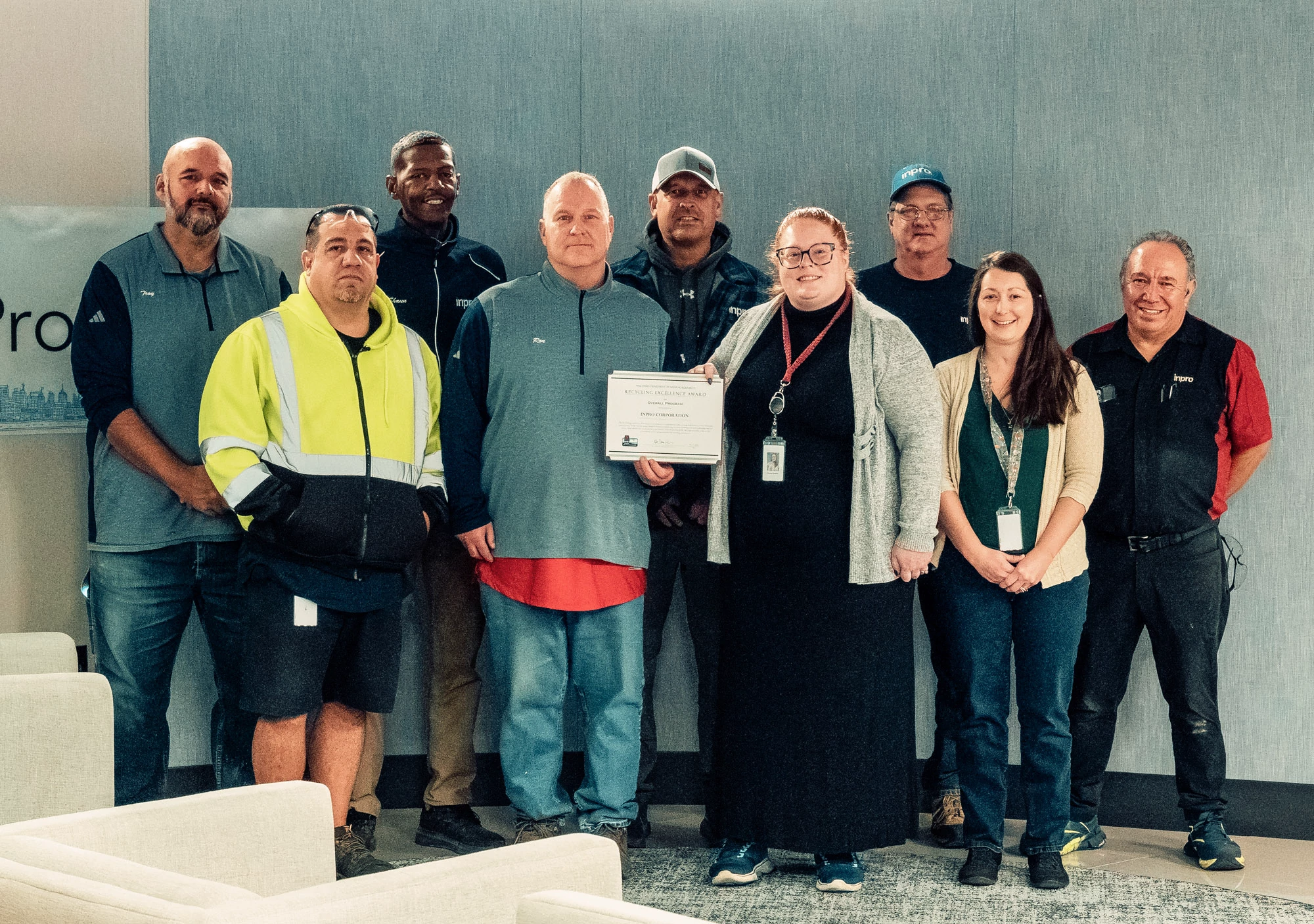 Members of Inpro Corporation posing with Recycling Excellence Award