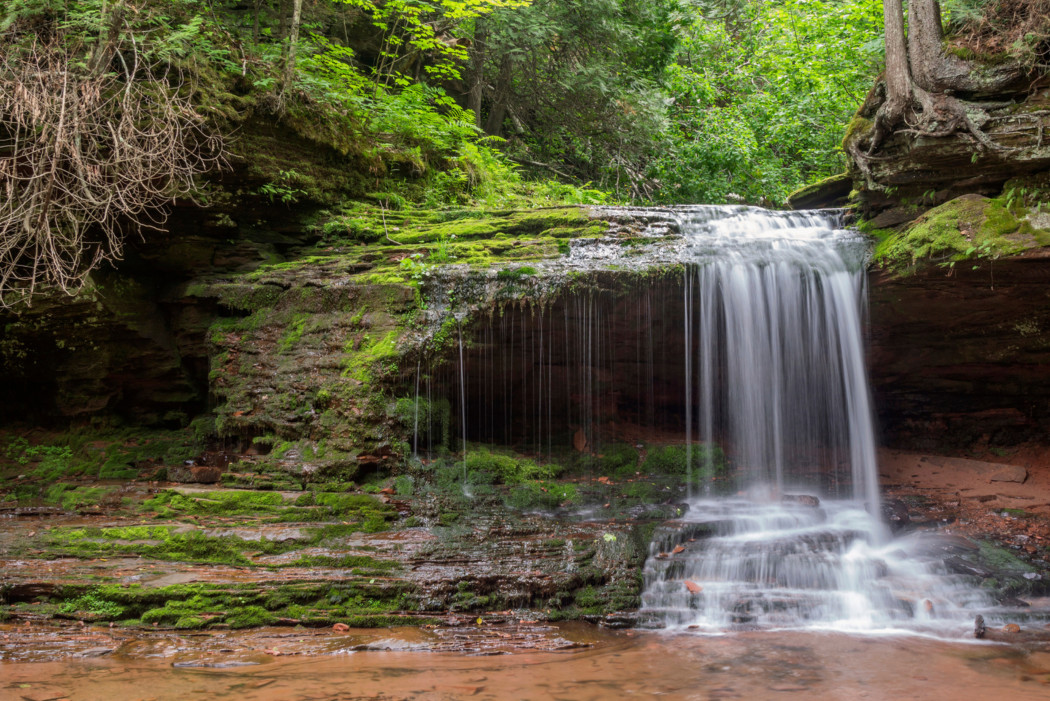 A long exposure shot of the Lost Creek Bog falls in northern Wisconsin on a summer day.