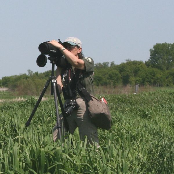 Karen Etter Hale looking through scope