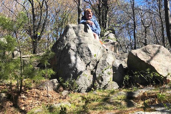 woman standing by rock formations