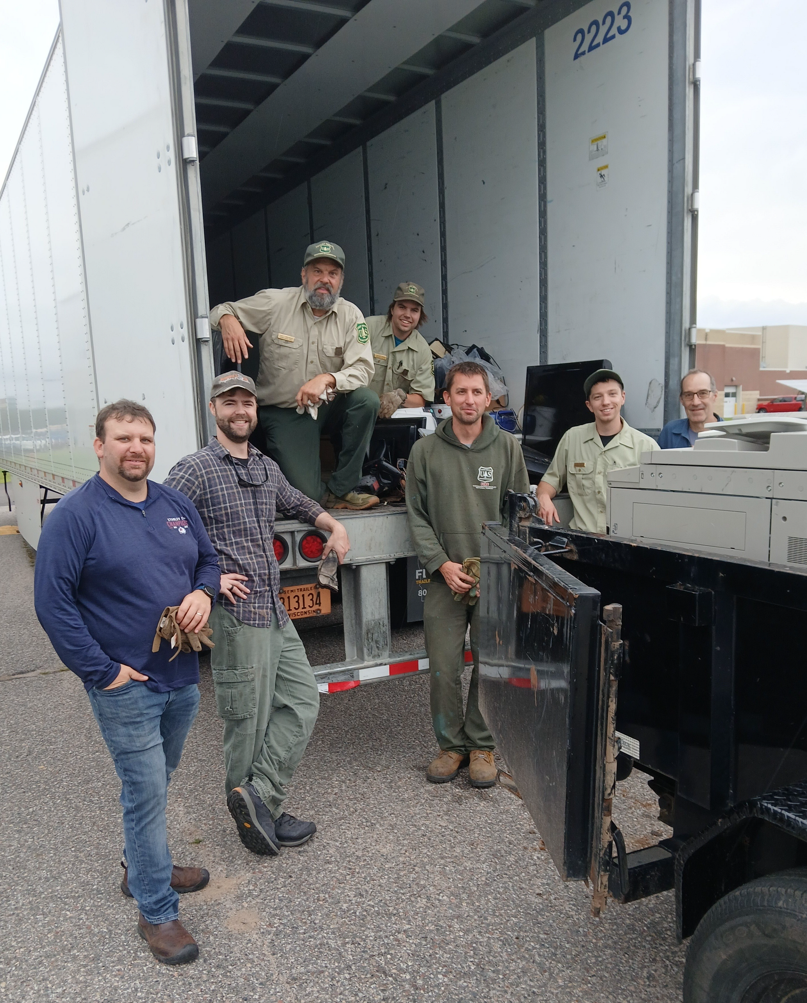 3rd Annual Recycling Extravaganza volunteers pose while loading truck