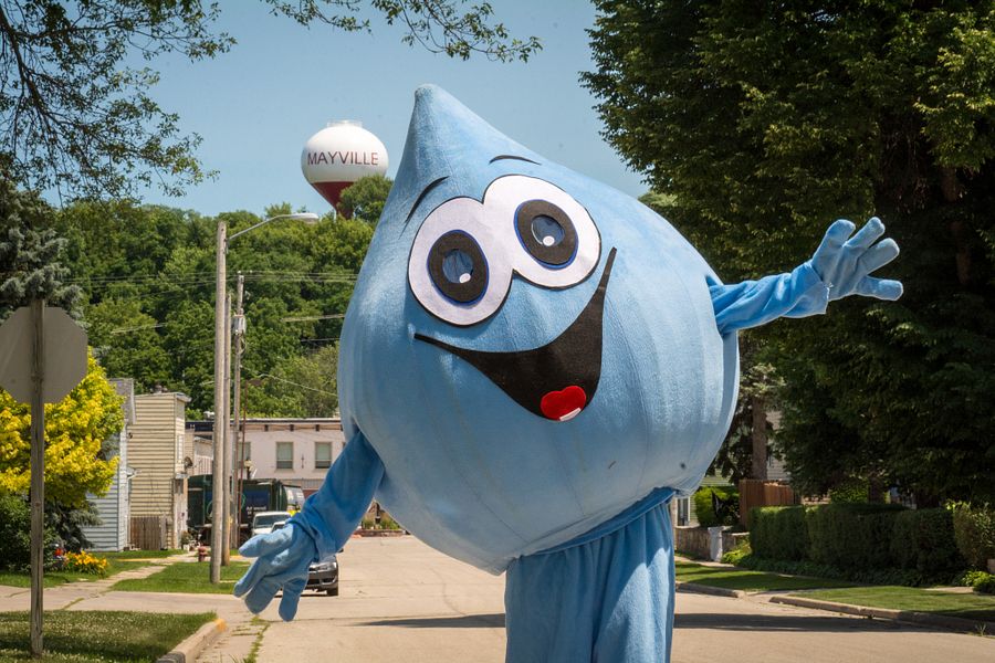 Spritz the friendly water droplet poses in front of the Mayville, Wis. water tower.