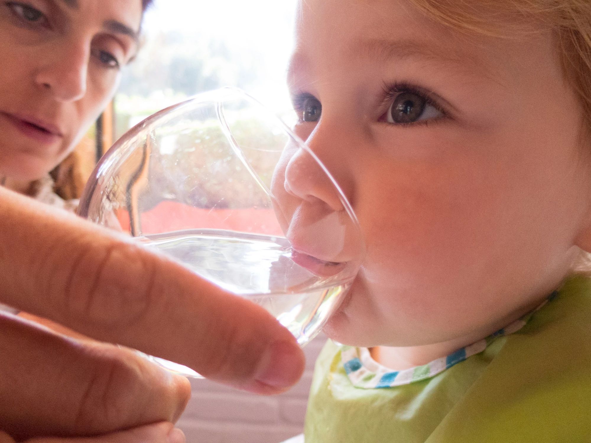 Baby drinking water from a cup
