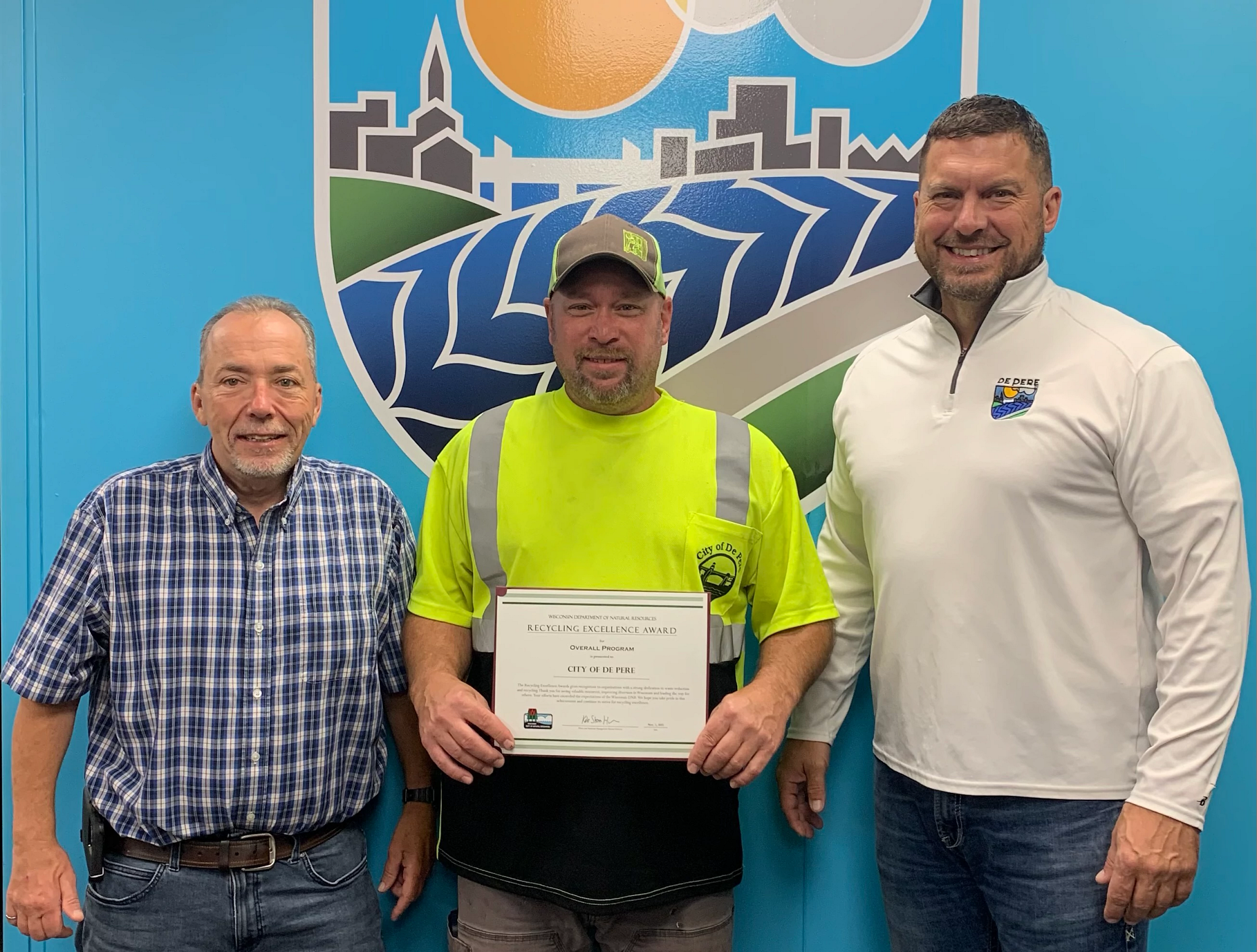 From left to right, Scott Thoresen, Director of Public Works; Greg Veeser, Equipment Operator; Tony Fietzer, Street Superintendent, posing with Recycling Excellence Award