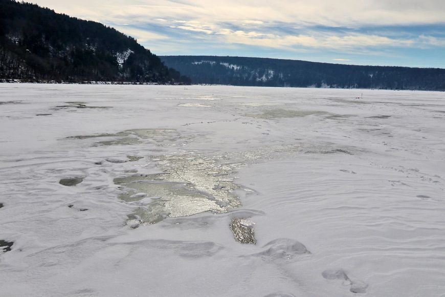 A view of patchy ice and snow covering Devil’s Lake