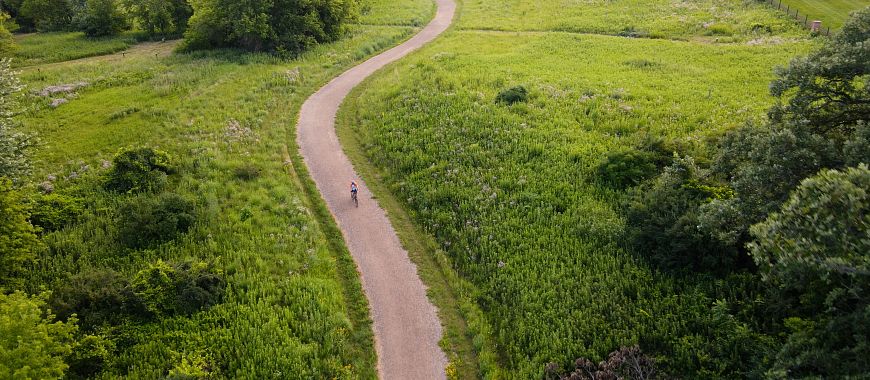 Overhead view of bicyclist on the Glacial Drumlin State Trail