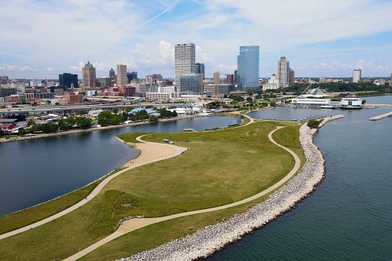 An aerial view of Lakeshore State Park on the shore of Lake Michigan with the city of Milwaukee in the background.