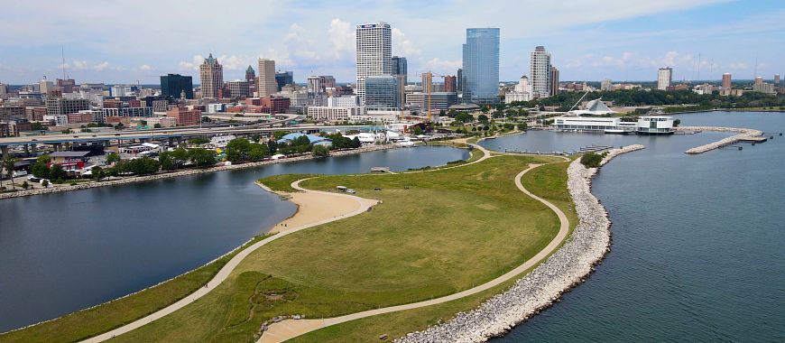 View of Lakeshore State Park with Lake Michigan shoreline and downtown Milwaukee in the background