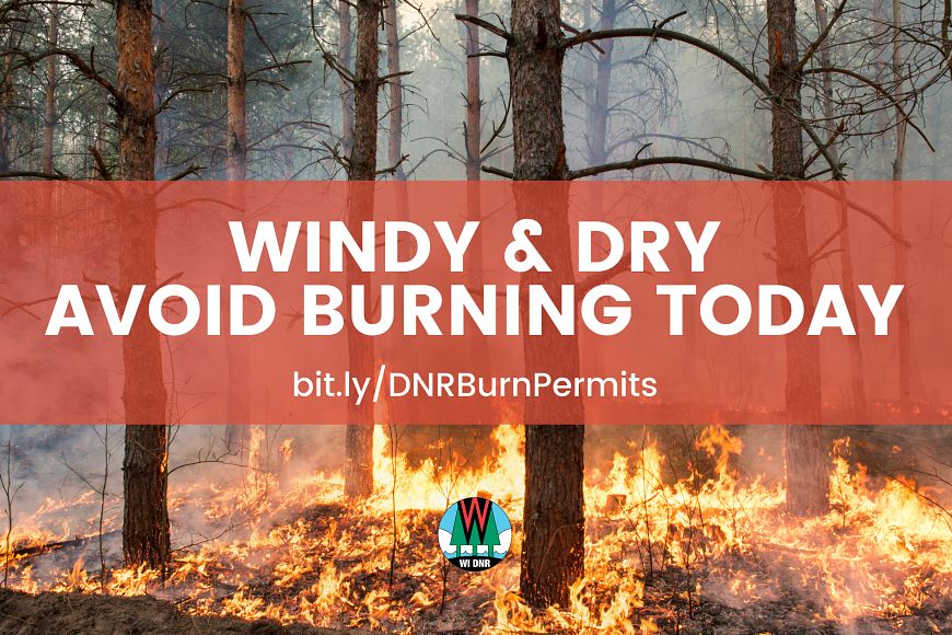 A graphic with a background showing a wildfire with text that reads "Windy & dry; avoid burning today."