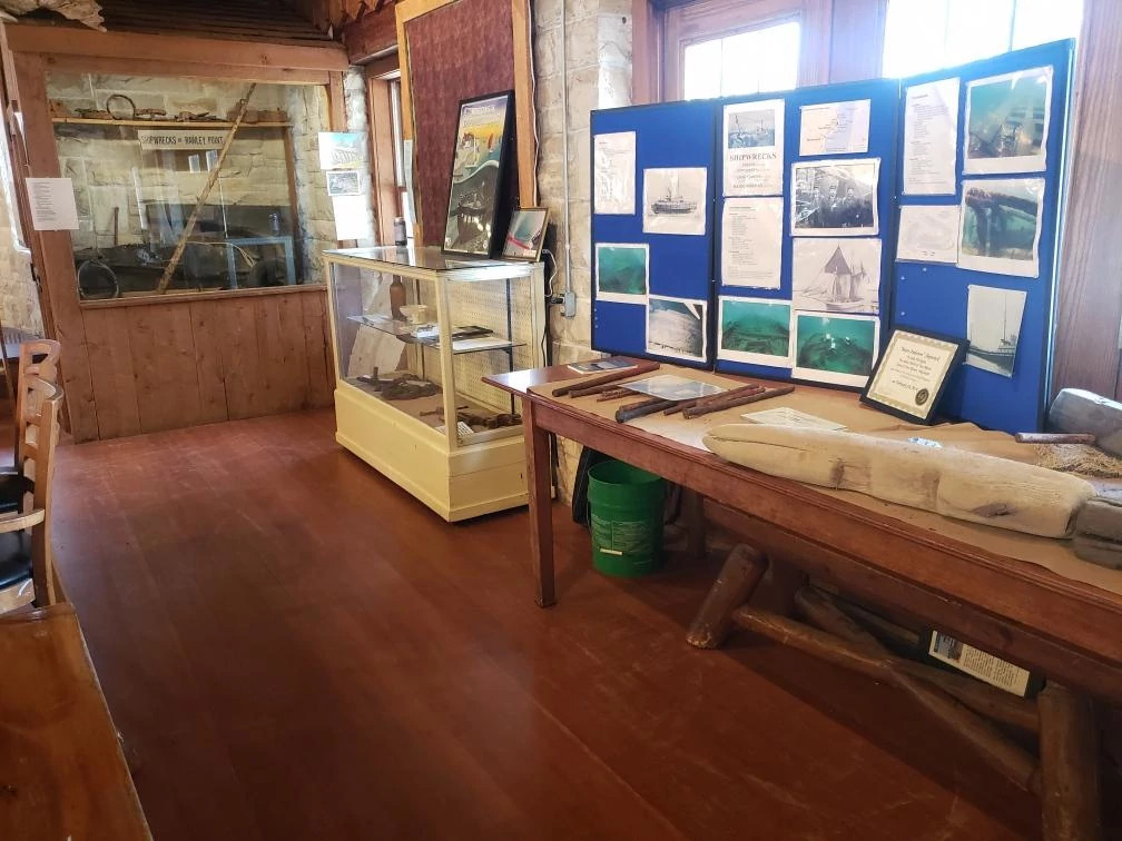 displays and artifacts on a table inside the nature center.