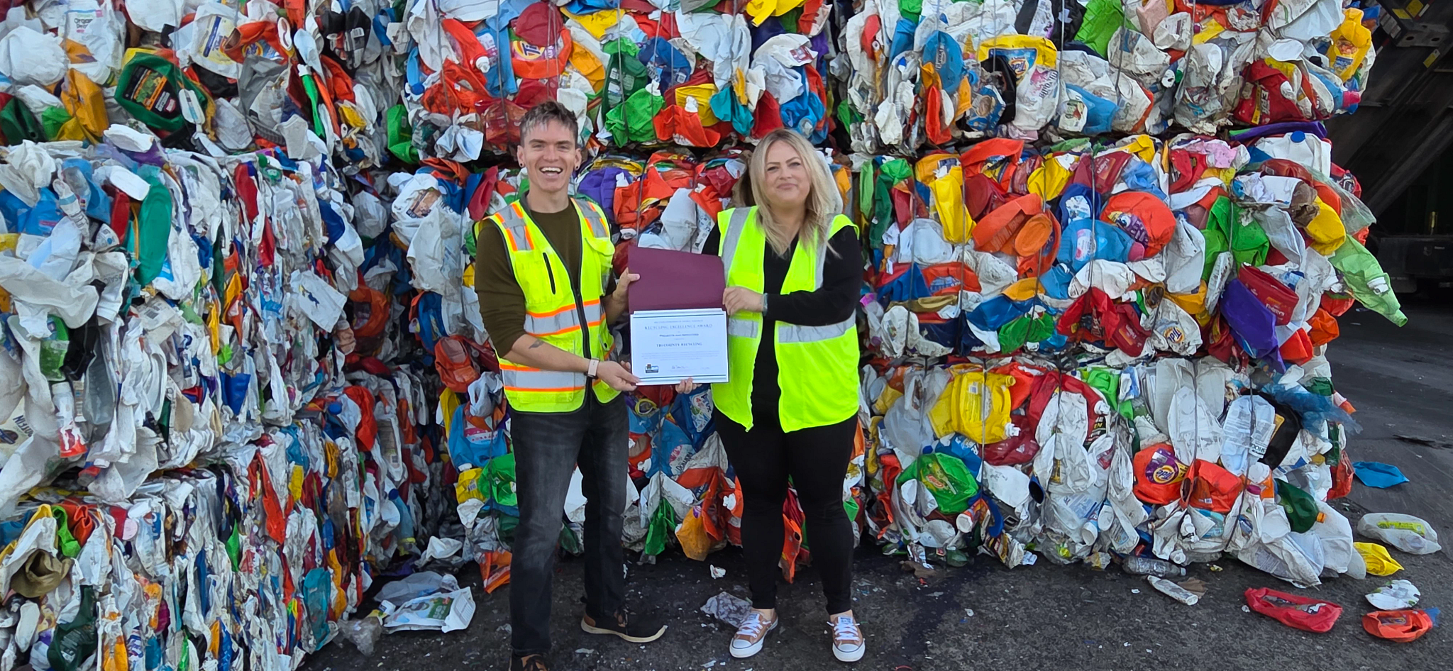 Employees of Tri-County Recycling posing with Recycling Excellence Award