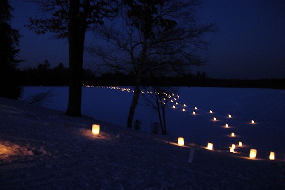 A candlelit trail at the annual candlelight ski event at Governor Thompson State Park. 